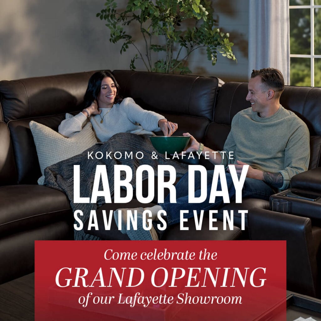 Couple relaxing on a leather sofa for a sale advertisement.